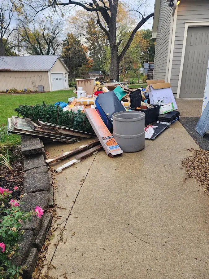 Dumpster being loaded with debris for 30 Yard Dumpster Rental in Cloverly